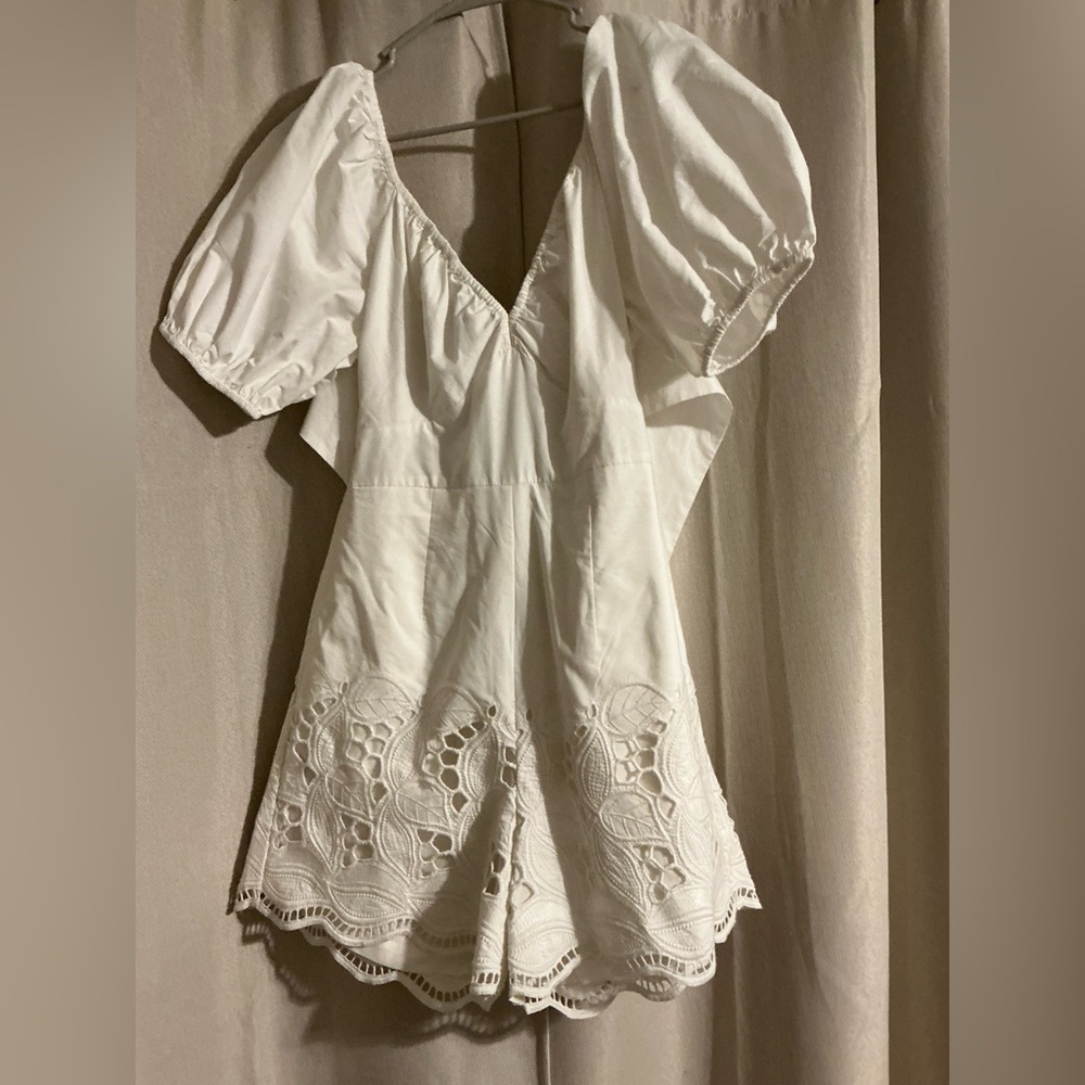 Anthropologie romper. Puffy sleeves, tie back, eyelet detail, vneck. Xs